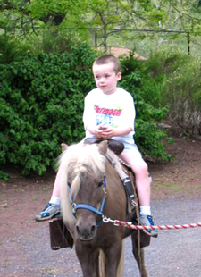 Ben riding a pony